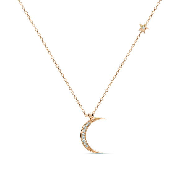 A magical 14 karat gold diamond necklace in rose gold that will become your day to night companion. Moon magic diamond gold necklace.