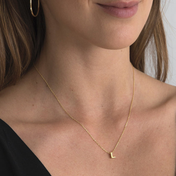 A 18 karat gold vermeil necklace with your initial letter "L". This diamond letter necklace is a special jewelry necklace that can be worn day and night. A genuine diamond stone in the corner of the letter makes this gold diamond necklace a luxury and ideal gift for yourself, your best friend or loved one. 